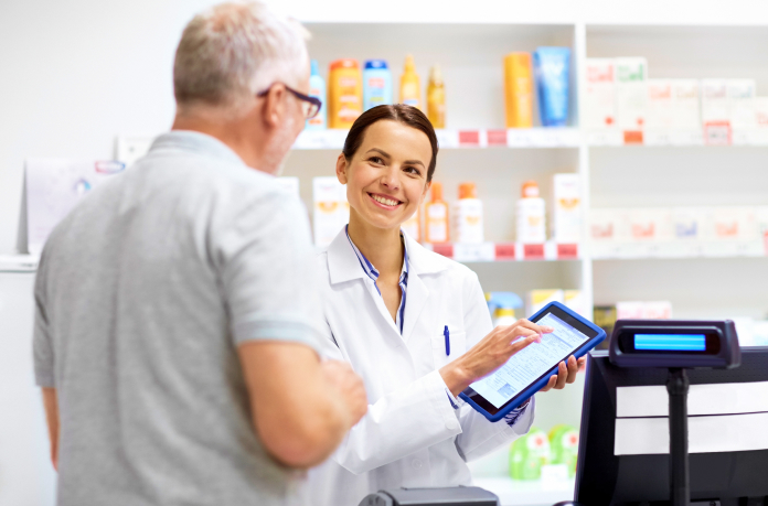 pharmacist helping customer 