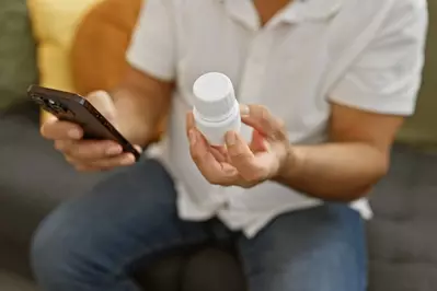 man refilling prescription