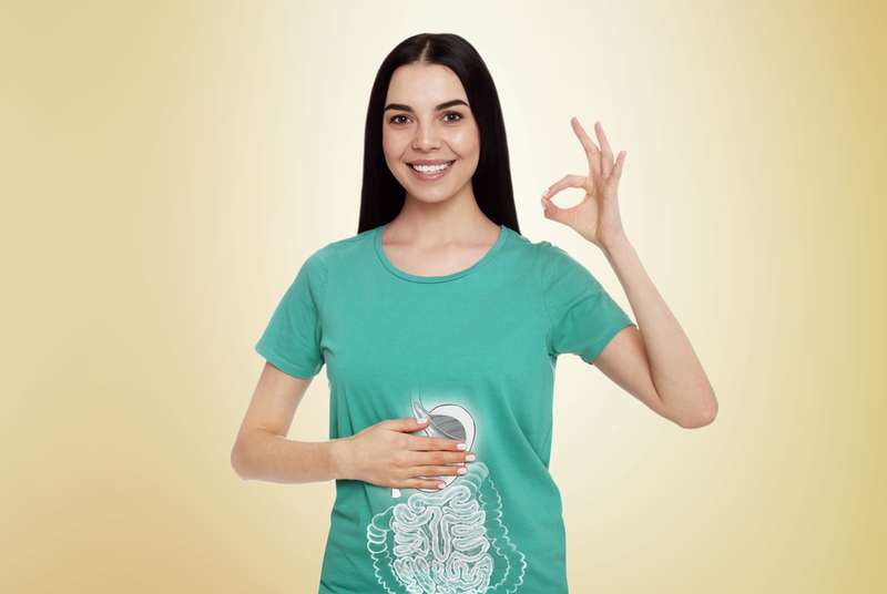 woman with good digestive health smiling